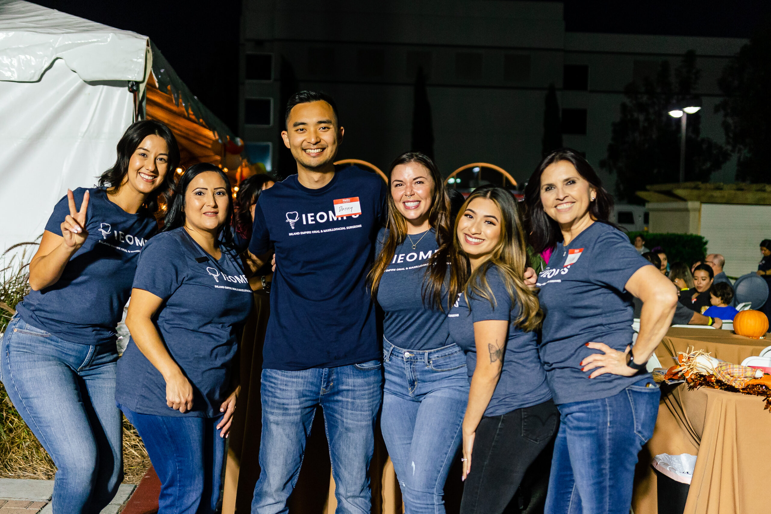 Pediatric oral surgery staff interacting with children at event