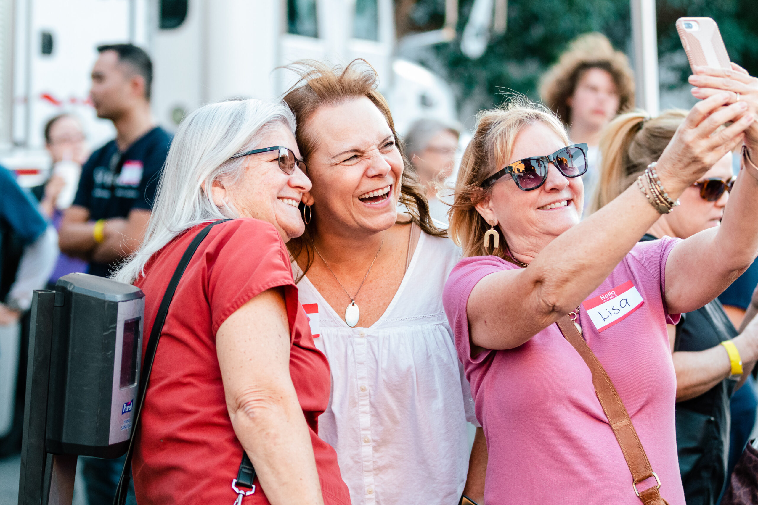 Oral surgeons explaining impacted canine surgery to families at outreach event