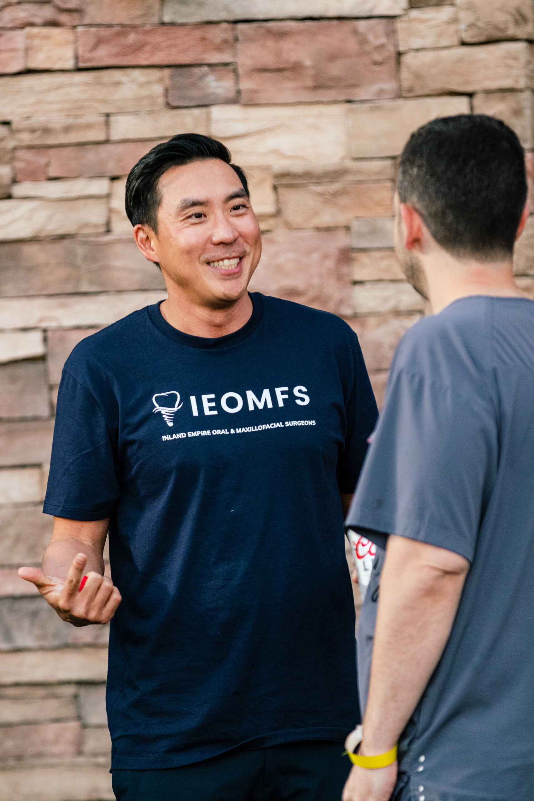 IEOMFS pediatric oral surgery staff discussing impacted canine procedures with children