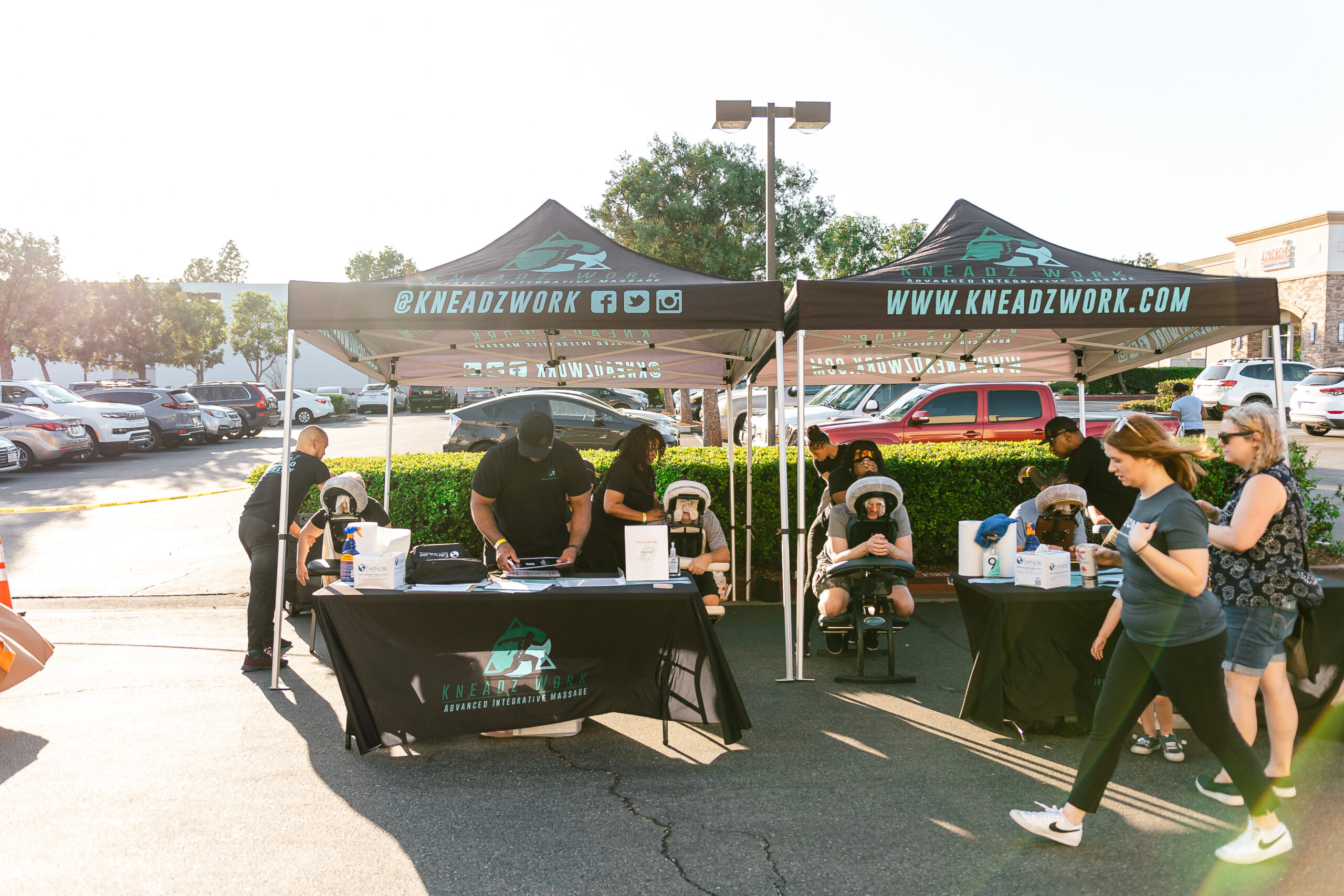 Surgeons and staff smiling at IEOMFS oral surgery event