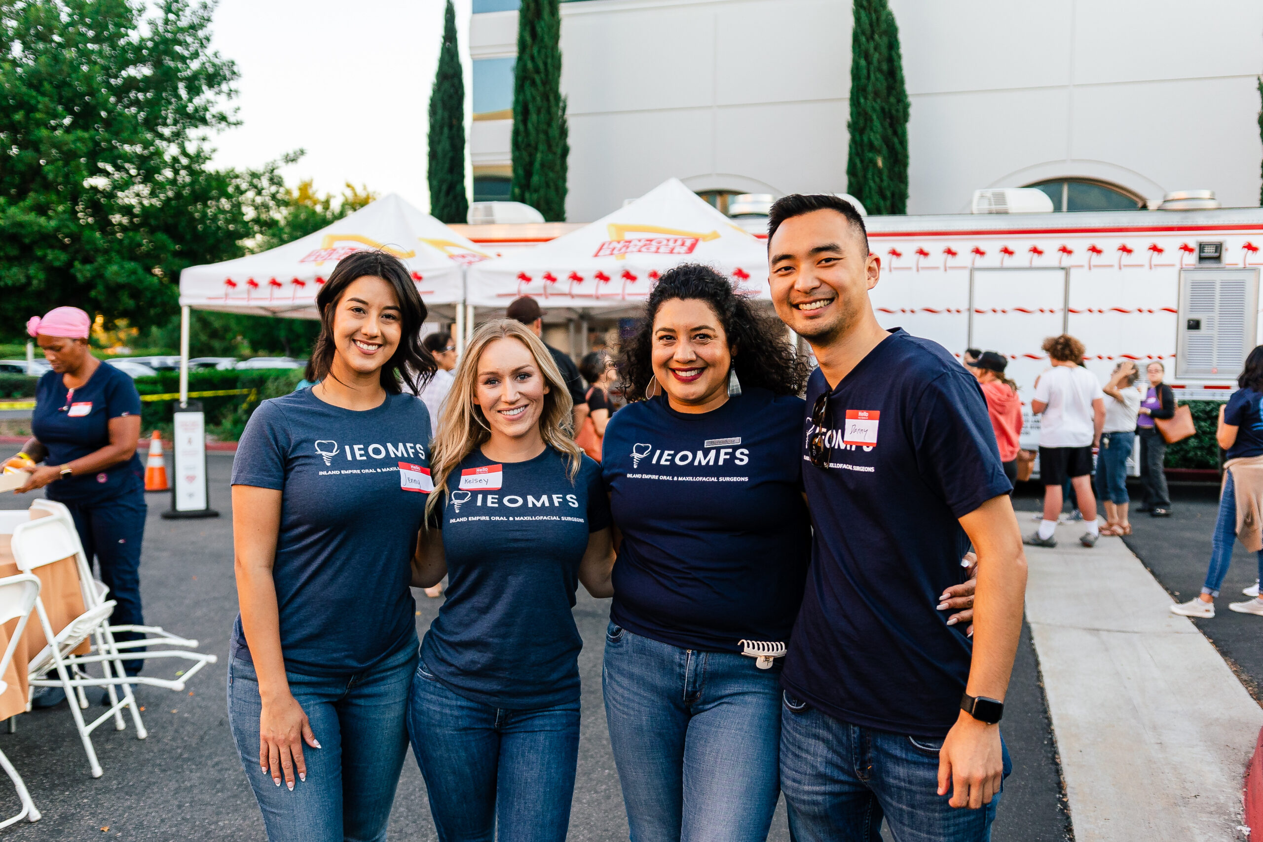 Smiling IEOMFS staff and surgeons during a practice event about anesthesia services