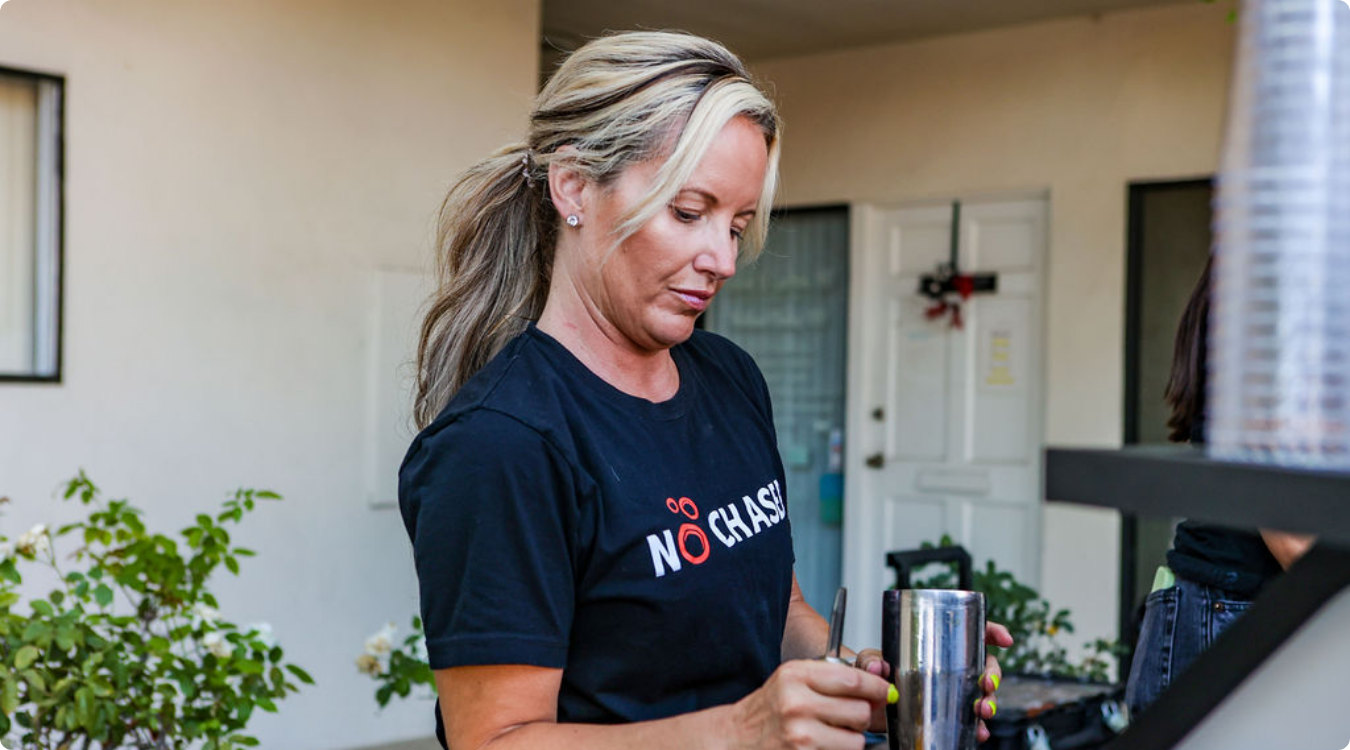 Smiling staff members at IEOMFS 2024 event